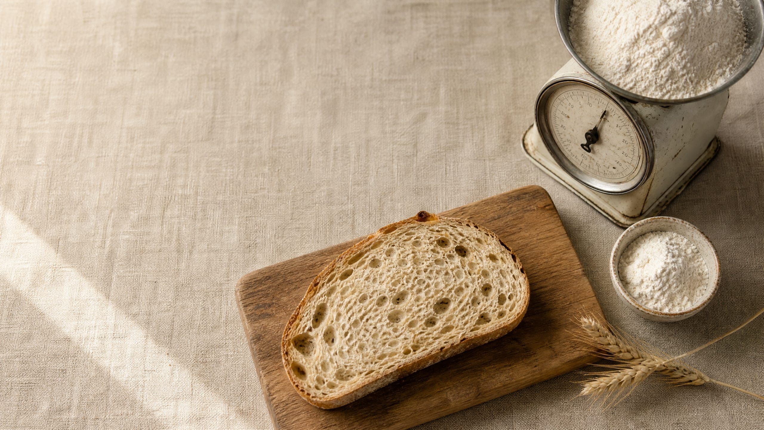 Sourdough Bread Nutrition: Carbs, Calories, and Why It's Different guide illustrated on a warm cream background